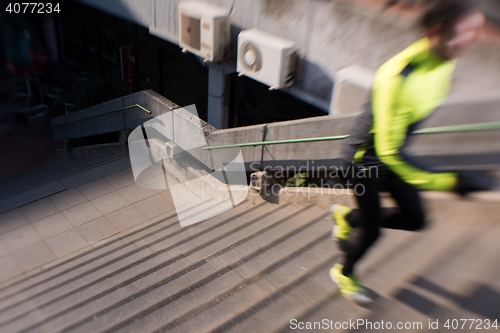 Image of man jogging on steps