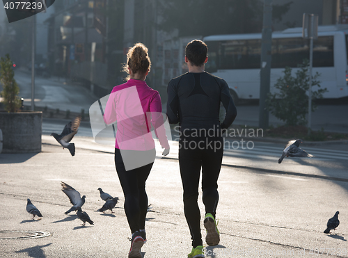 Image of young  couple jogging