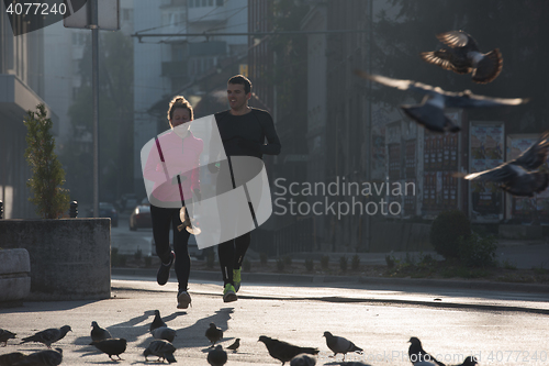 Image of young  couple jogging