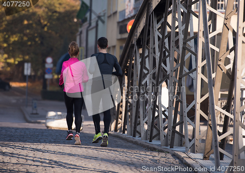 Image of young  couple jogging