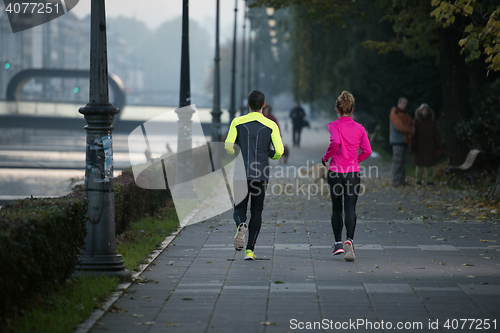 Image of young  couple jogging