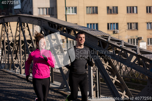 Image of young  couple jogging