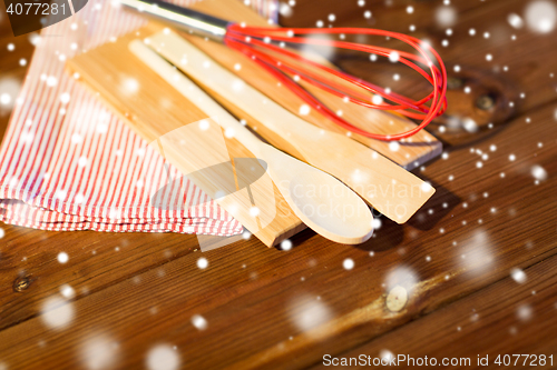 Image of close up of cooking kitchenware on wooden board