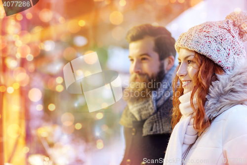 Image of happy couple walking outdoors