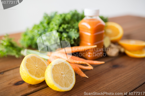 Image of lemon with carrot juice, fruits and vegetables