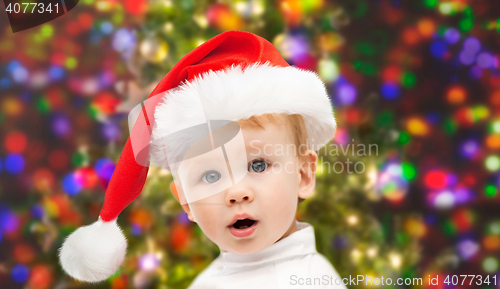 Image of beautiful little baby boy in christmas santa hat