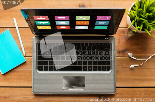 Image of close up of laptop computer on wooden table