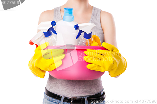 Image of Unknown female holding cleaning substance.
