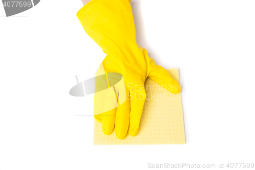 Image of Arm in rubber gloves removes dust