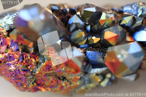 Image of crystal with metal rainbow surface