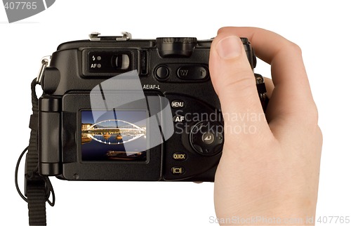 Image of Digital Camera photo in a hand isolated on withe background. lcd screen and background can be easily edited