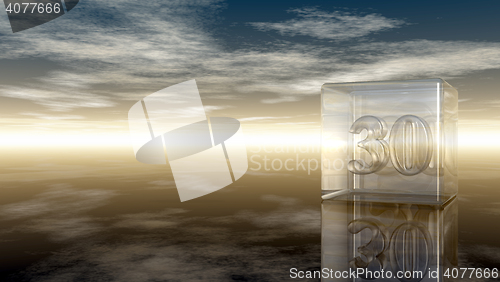 Image of number thirty in glass cube under cloudy sky - 3d rendering