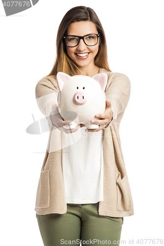 Image of Woman holding piggybank