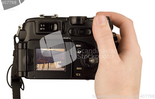 Image of Digital Camera photo in a hand isolated on withe background. lcd screen and background can be easily edited