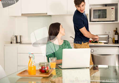 Image of Young couple on the kitchen