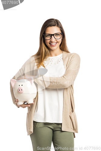 Image of Woman holding piggybank