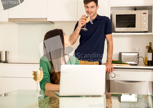 Image of Young couple on the kitchen