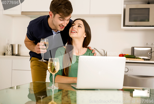 Image of Young couple on the kitchen