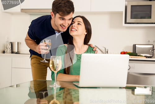 Image of Young couple on the kitchen