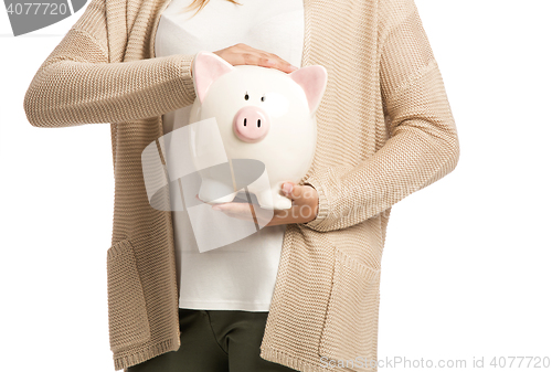 Image of Woman holding piggybank