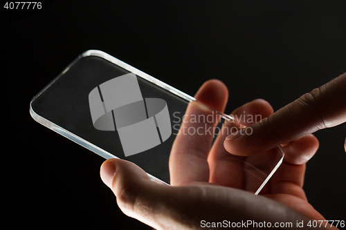 Image of close up of businessman with glass smartphone
