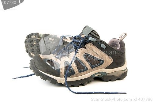 Image of clothes hiking boots or shoes isolated on a withe background made of leather and waterproof and breathable membrane