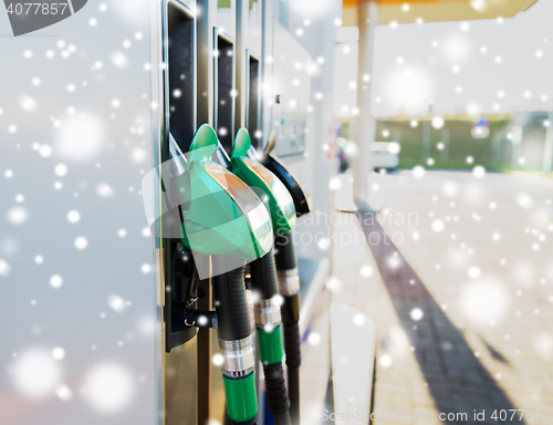 Image of close up of gasoline hose at gas station