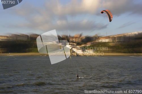 Image of beach sport water kite surf. a man practicing kite surfing in the beach