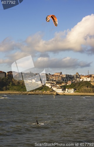 Image of beach sport water kite surf. a man practicing kite surfing in the beach