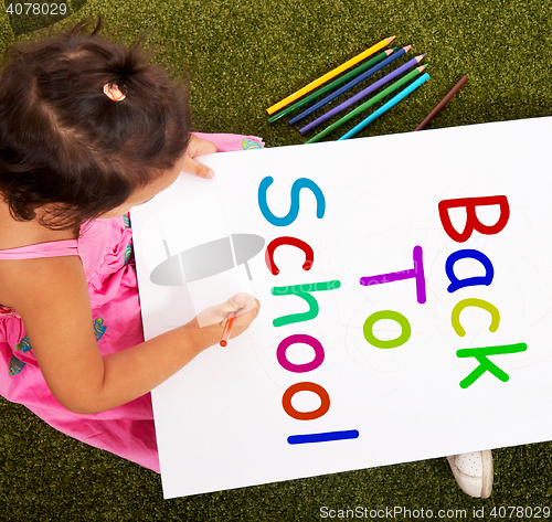 Image of Girl Writing Back To School As Symbol For Education