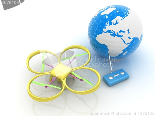 Image of Quadrocopter Drone with Earth Globe and remote controller on a w