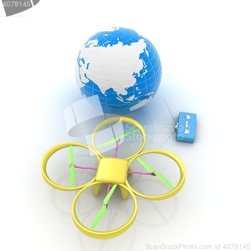 Image of Quadrocopter Drone with Earth Globe and remote controller on a w