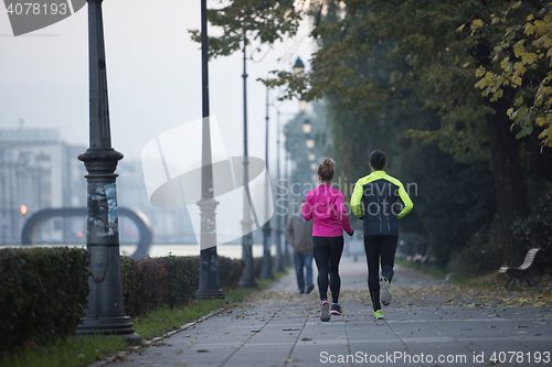 Image of young  couple jogging