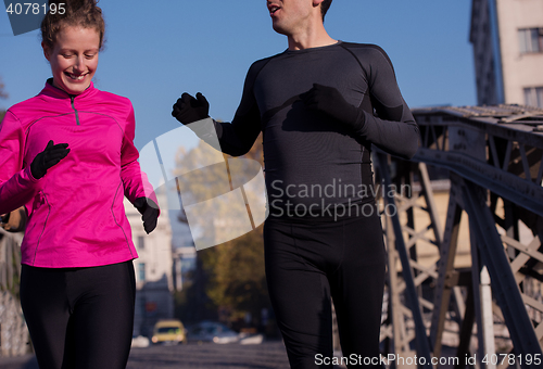 Image of young  couple jogging