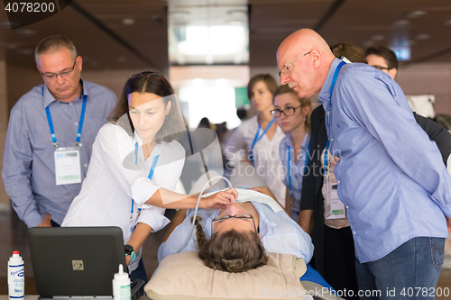 Image of Participants learning new ultrasound techniques on medical congress.