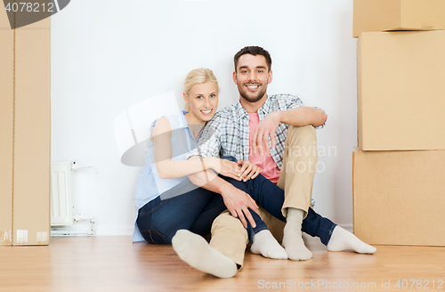 Image of couple with cardboard boxes moving to new home