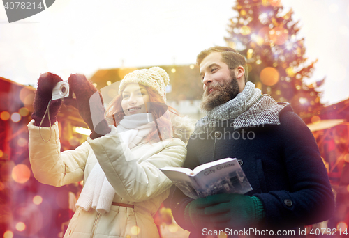 Image of couple taking selfie with smartphone in old town