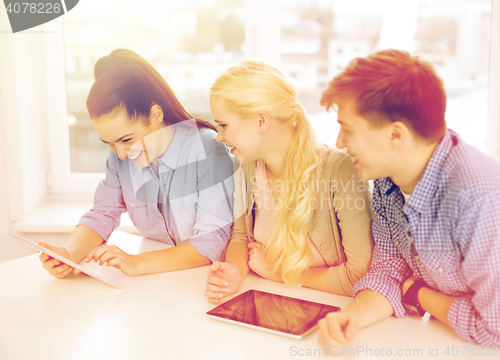 Image of smiling students with tablet pc computer at school