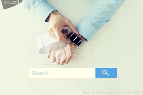 Image of hands with internet browser search on smartwatch