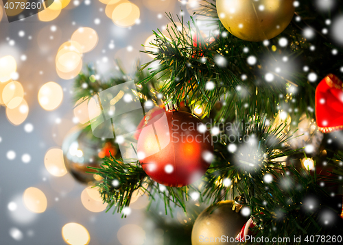 Image of close up of christmas tree decorated with balls