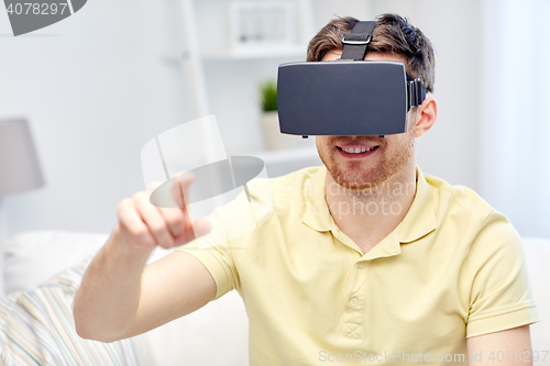 Image of young man in virtual reality headset or 3d glasses