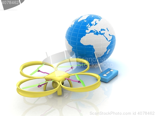 Image of Quadrocopter Drone with Earth Globe and remote controller on a w