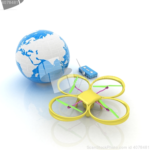 Image of Quadrocopter Drone with Earth Globe and remote controller on a w