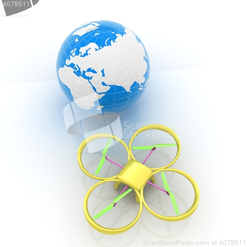 Image of Quadrocopter Drone with Earth Globe and remote controller on a w