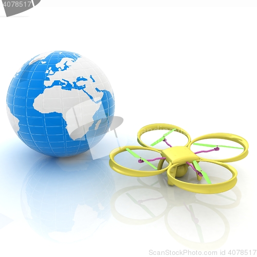 Image of Quadrocopter Drone with Earth Globe and remote controller on a w