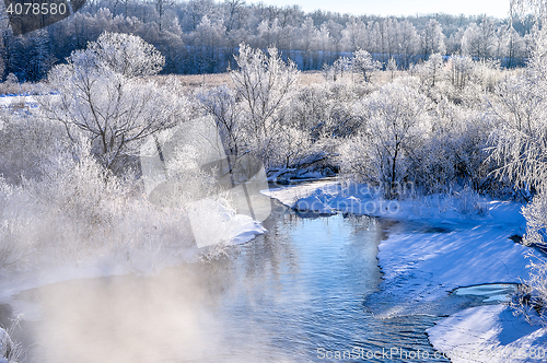 Image of Winter sunny landscape with river and forest