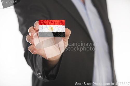 Image of Businessman holding business card with Egypt flag