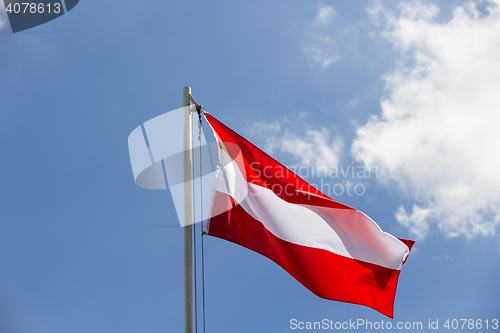 Image of National flag of Austria on a flagpole
