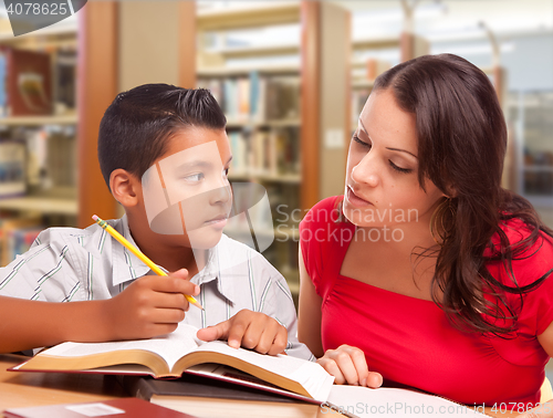 Image of Hispanic Mother and Son Studying In Library