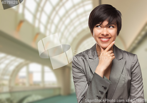 Image of Businesswoman Inside Corporate Building Looking To The Side